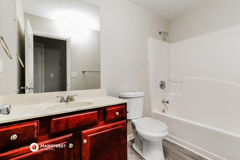 a bathroom with a sink toilet and a shower