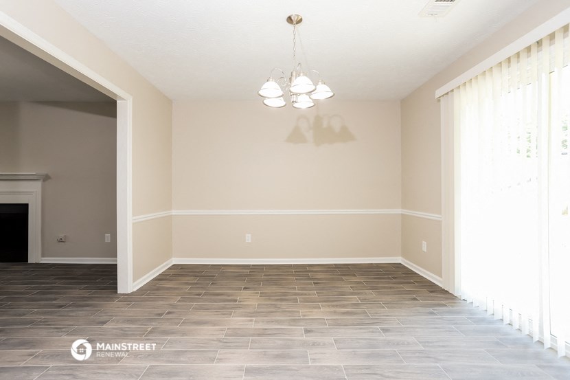 the dining room and living room of a new home