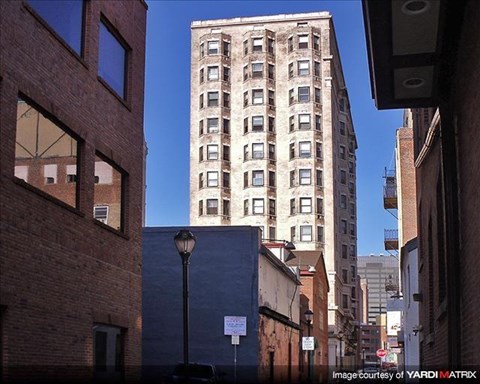 a tall building in the middle of a city street