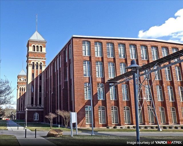 a large brick building with a clock tower