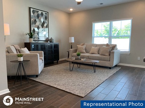 a living room with a couch and a table