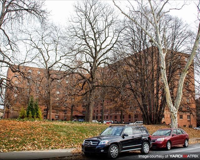 two cars parked in front of a building