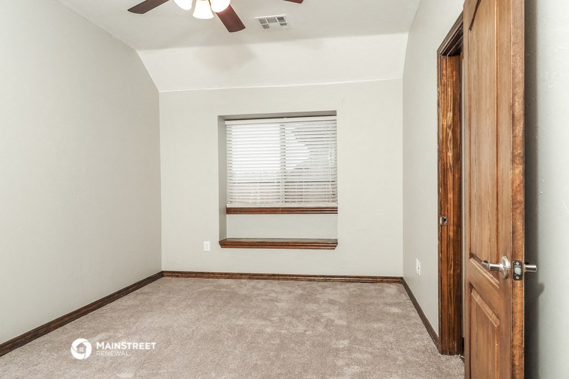 the bedroom is spacious and has a closet and a window