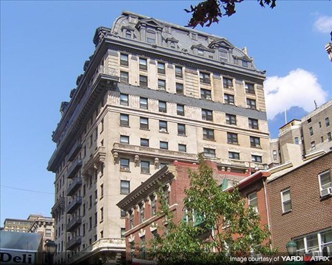 a tall building on the side of a street