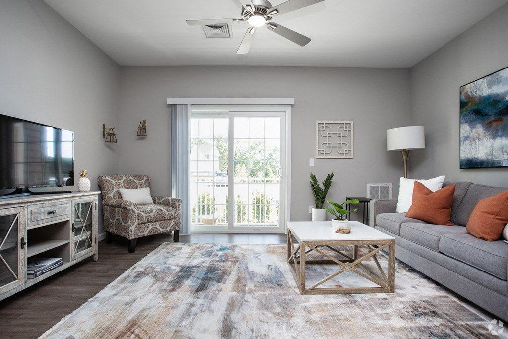 a living room with a couch and a tv