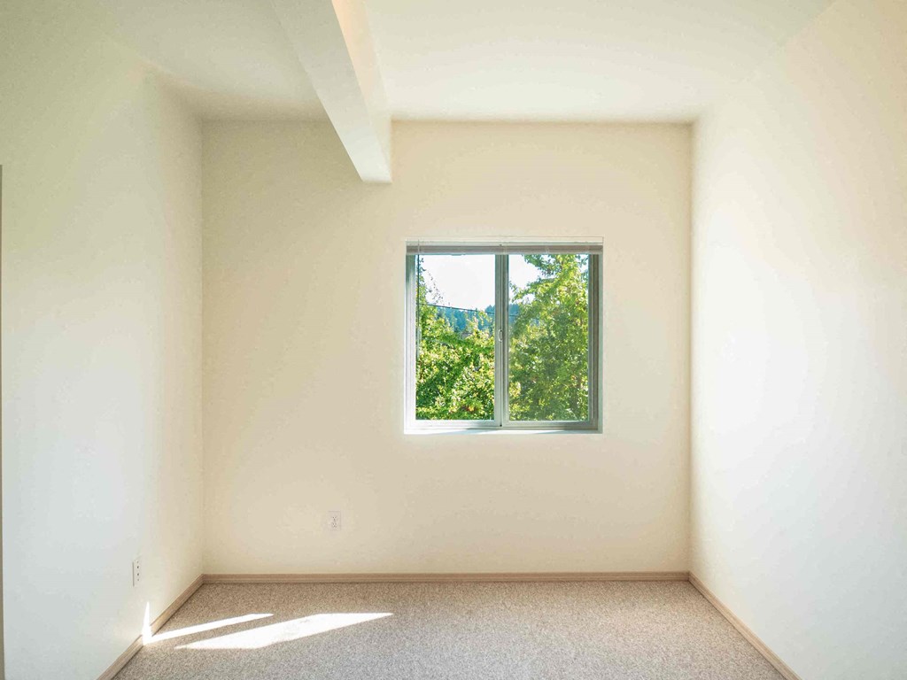 an empty room with a window in it