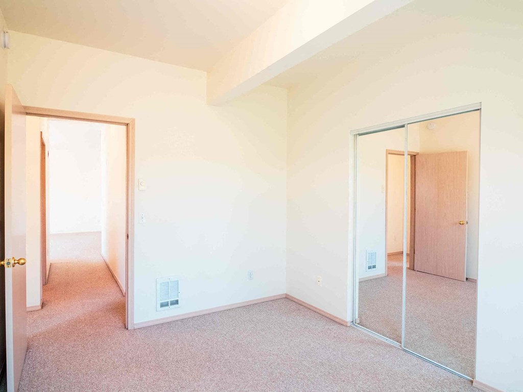 a empty room with a mirror in it