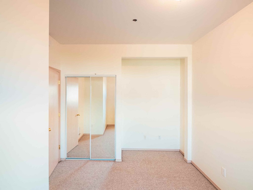 a empty room with a mirror in it