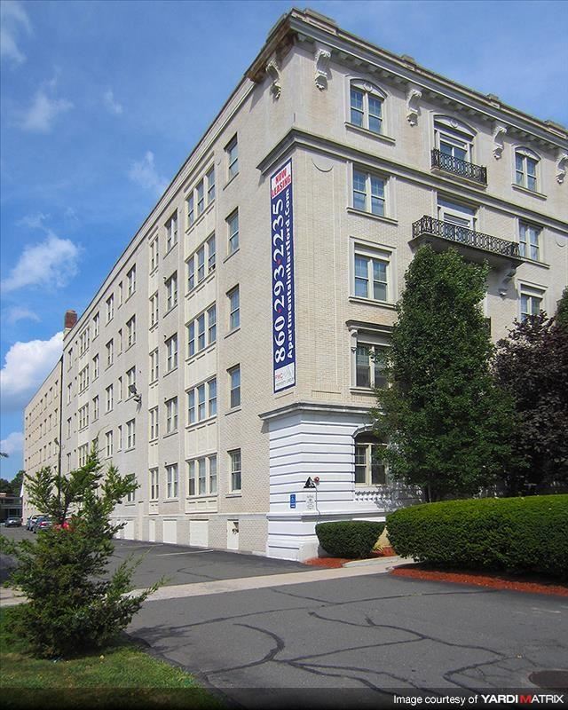 a large white building with a sign on the side of it