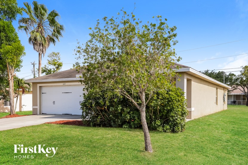 A house with a tree in front of it.