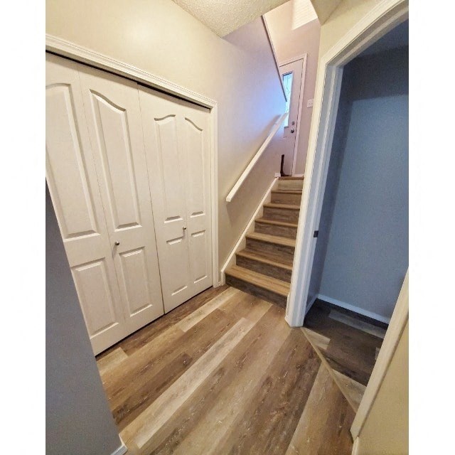 the stairwell to the second floor has a large closet and a set of stairs