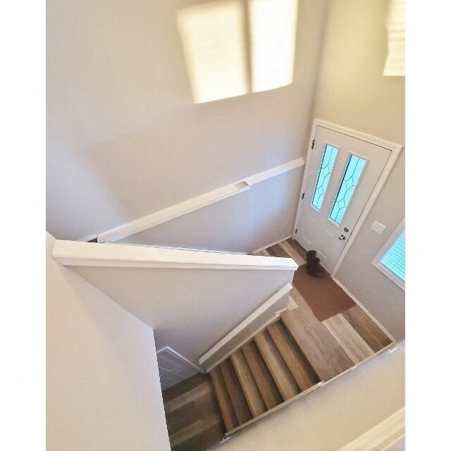 a view of a stairwell from the top of the stairs