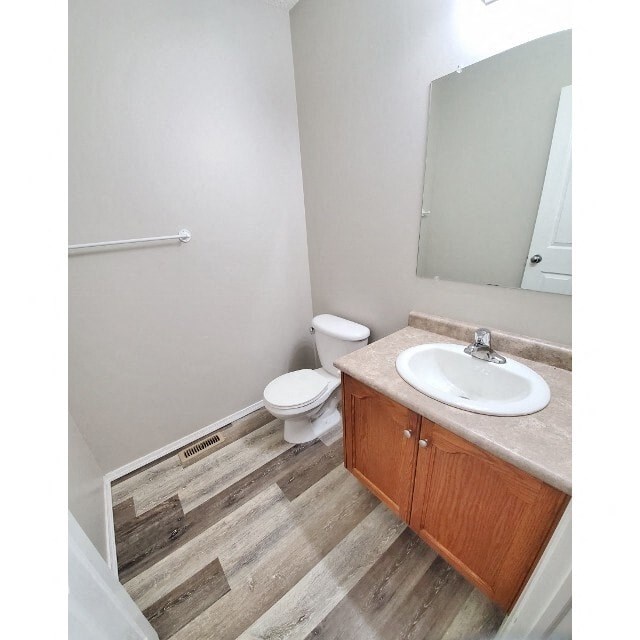 a bathroom with a sink and a toilet and a mirror