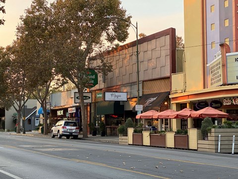 a car parked on a street in front of a building