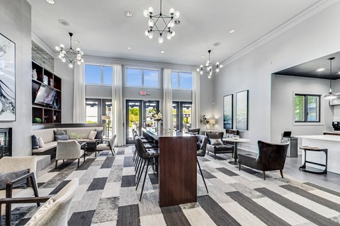 a large living room with a dining room table and chairs