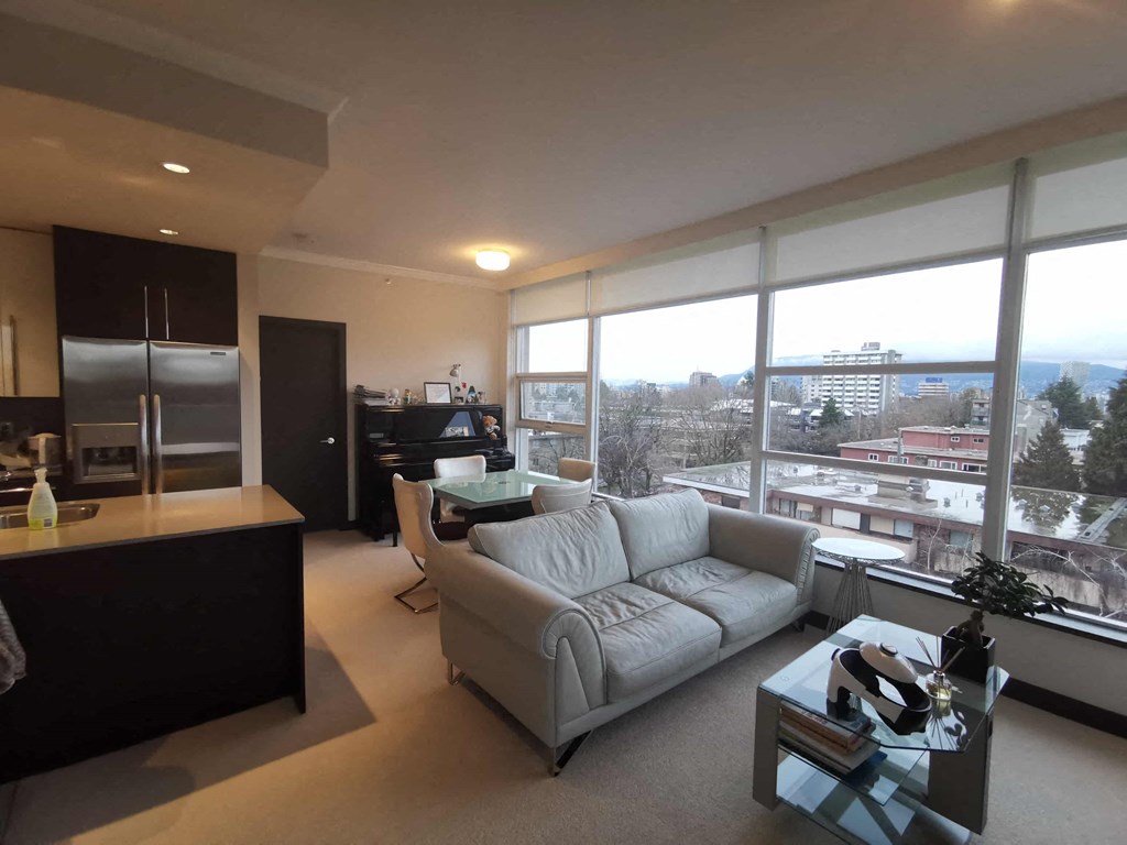 the living room of an apartment with a couch and a table