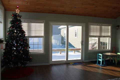 a christmas tree in the corner of a living room