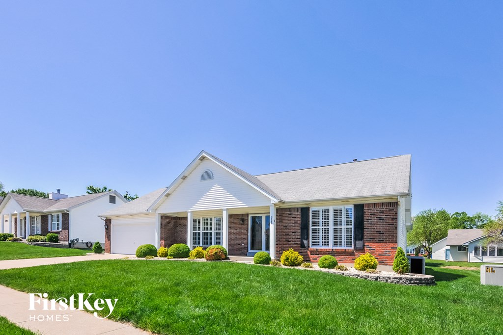 a home with a lawn in front of it