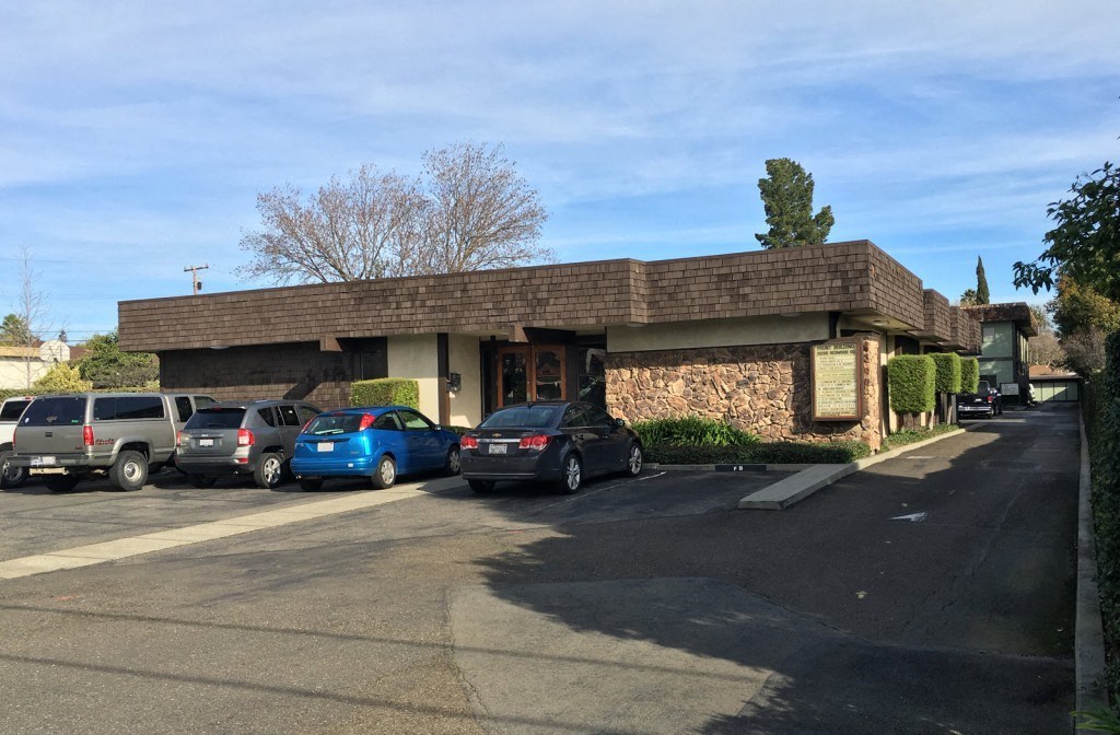 a building with cars parked in front of it