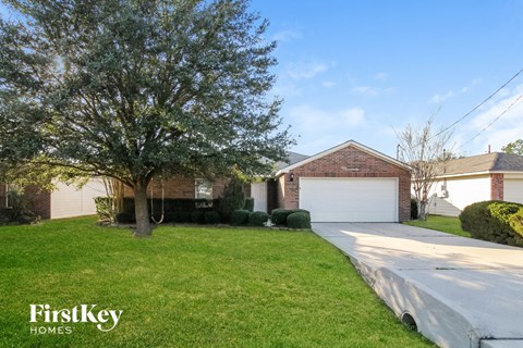 a house with a driveway and a garage door