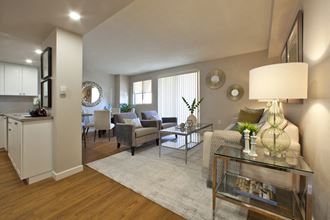 Trillium Apartments open concept living room and dining room area In Cobourg, ON