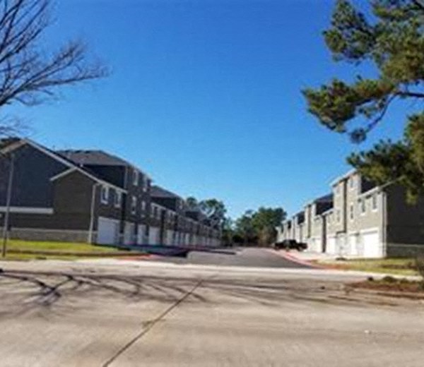 a row of houses on the side of a street