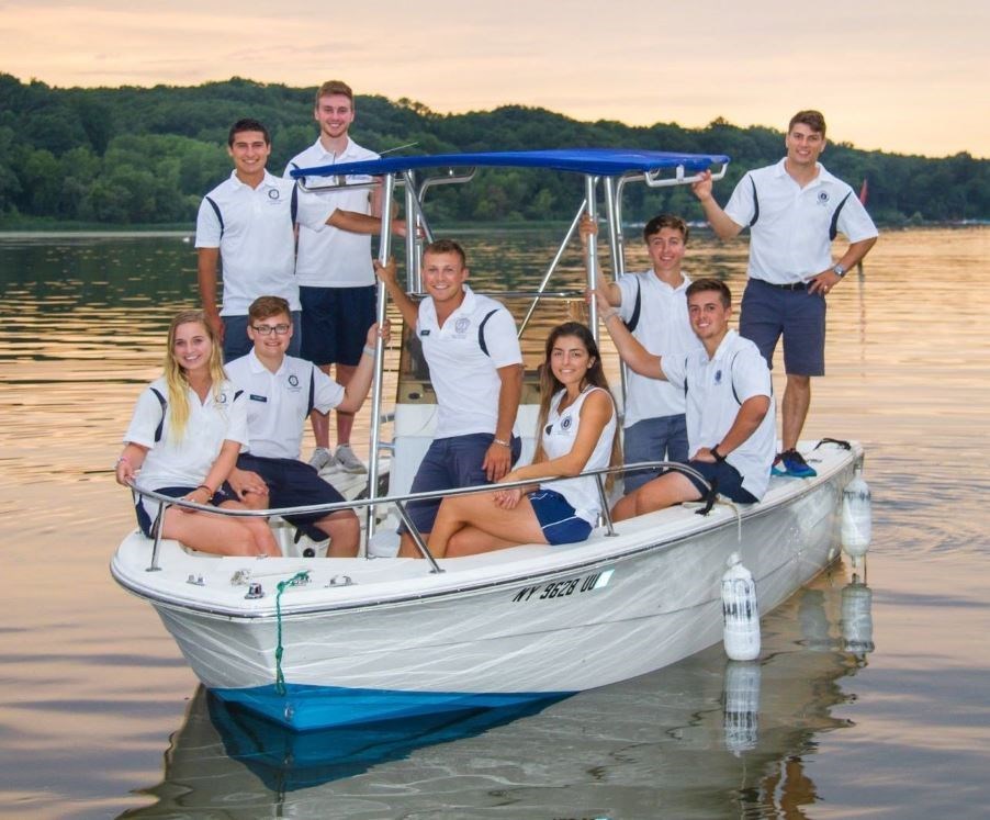 a group of people on a boat on a lake