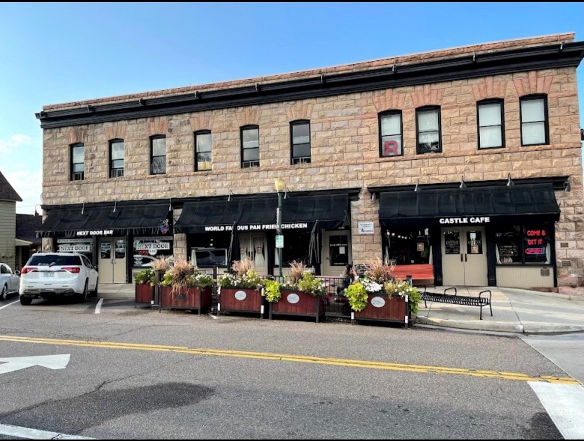 a brick building on the corner of a city street