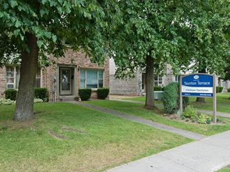 Taunton Terrace in Oshawa, ON exterior of property with monument sign