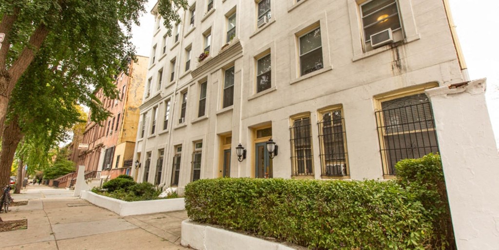 a row of buildings on a city street