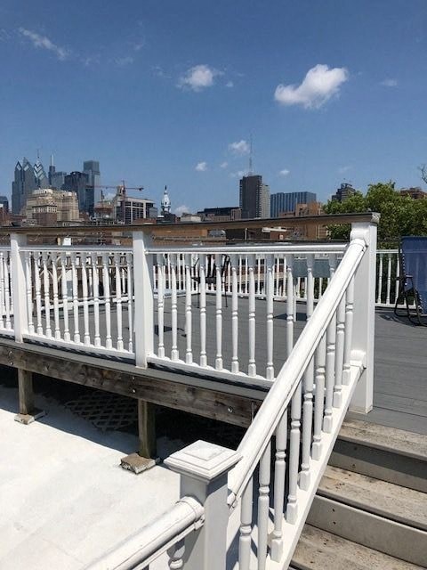 a white balcony with a view of the city