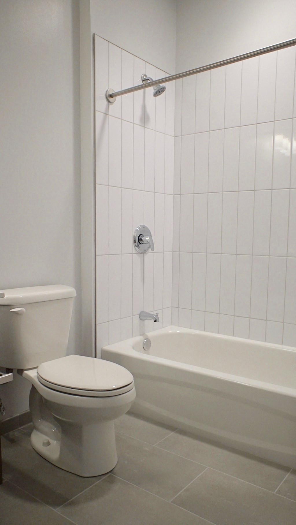 a bathroom with a toilet and a bath tub