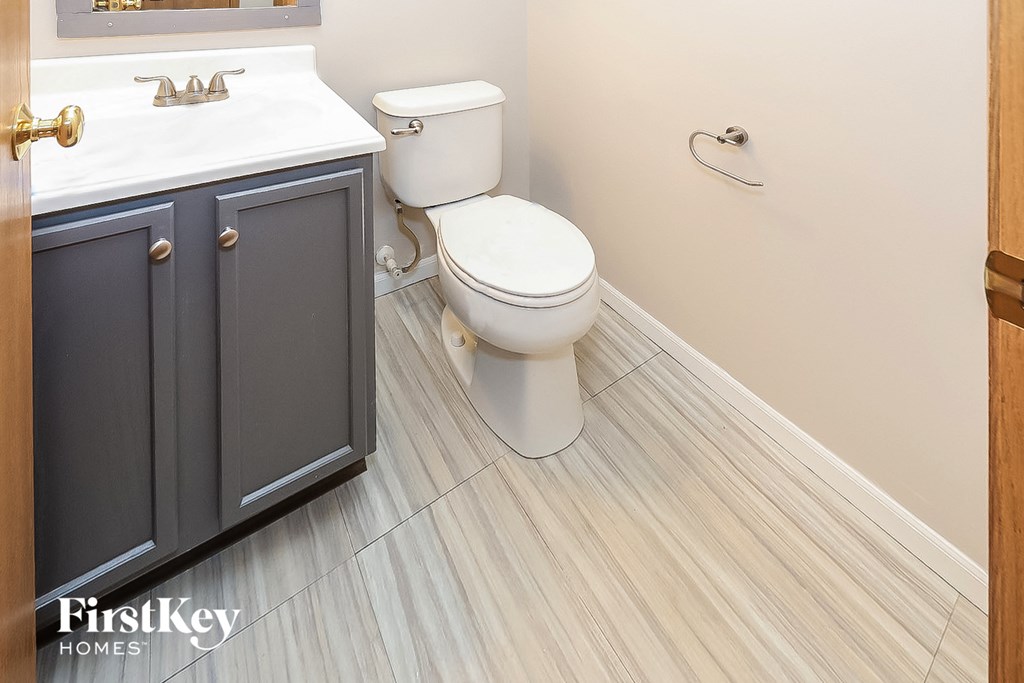 a bathroom with a toilet and a sink