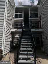 an old building with stairs going up to it