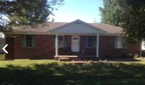 A house with a white door and windows.