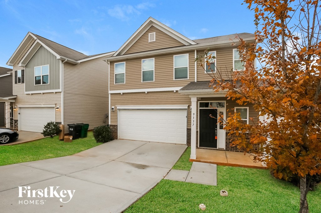 A house with a brown and beige exterior is for sale.