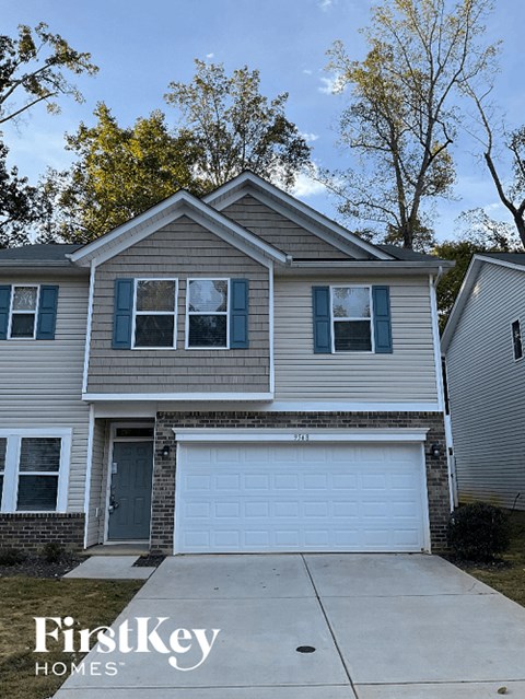 a house with a white garage door in front of it