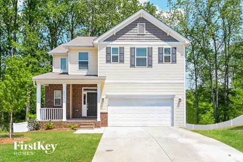 A two-story house with a garage is for sale by FirstKey Homes.