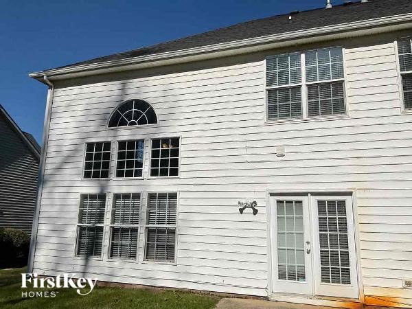 a white house with white siding and windows