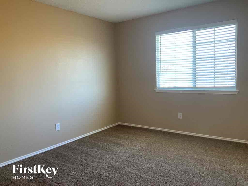 a room with carpet and a window in it