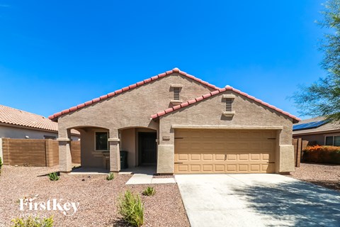 front view of a brick house with a garage door