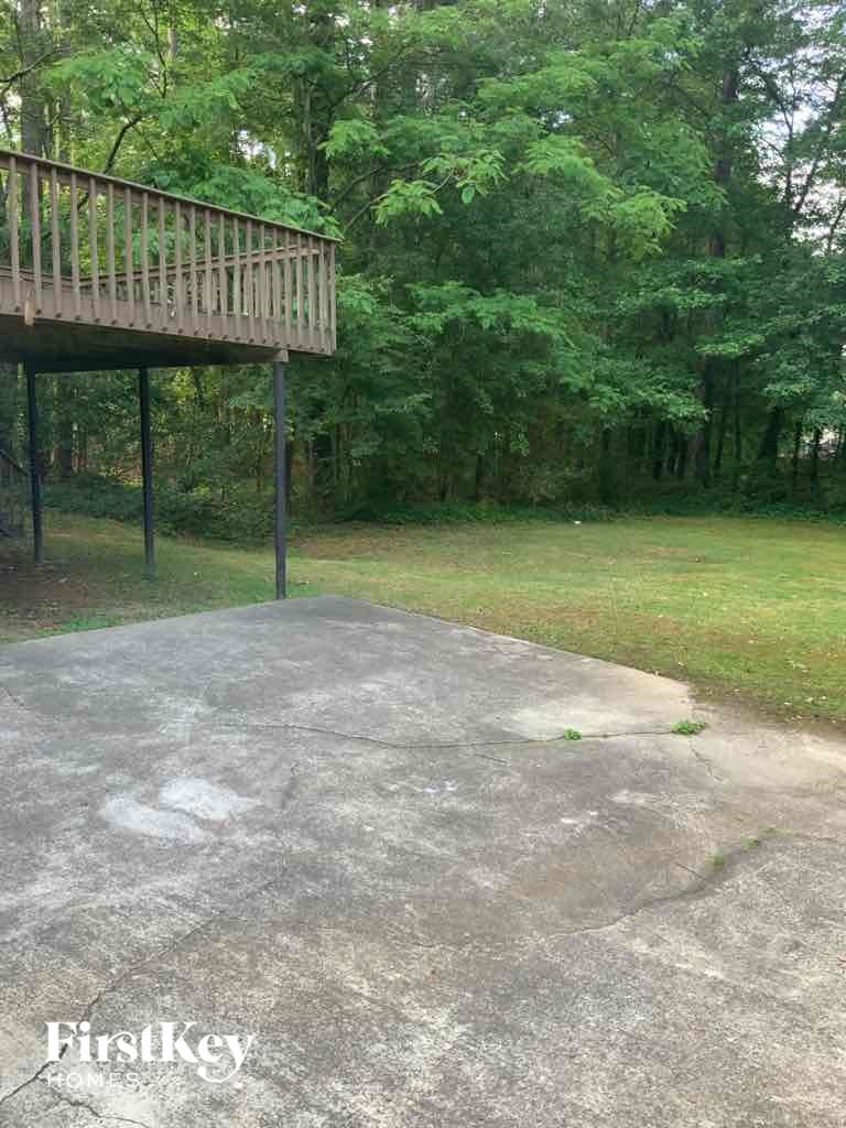 a large cement area with a deck on top of it