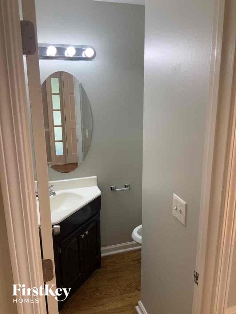 a small bathroom with a sink and a mirror