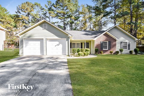 A house with a garage is for sale by FirstKey Homes.