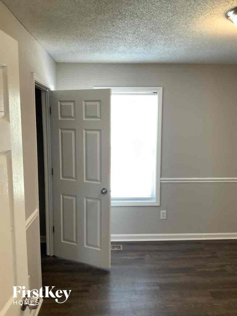 A room with a door and a window.