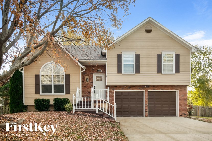 a house with a driveway and a garage door