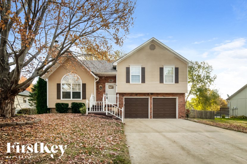 a house with a driveway and a garage door