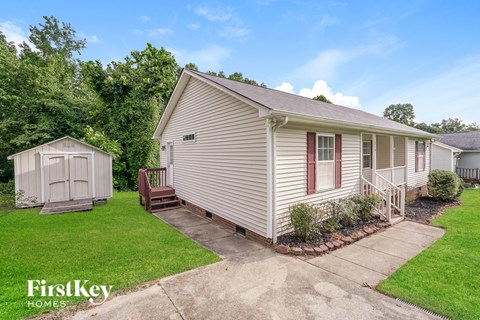 A house with a red window is part of a FirstKey Homes property.