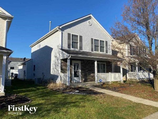 A house with a porch and a sign that says FirstKey Homes.