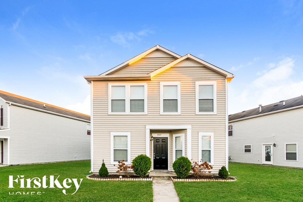 A house with the words "FirstKey Homes" on the front lawn.